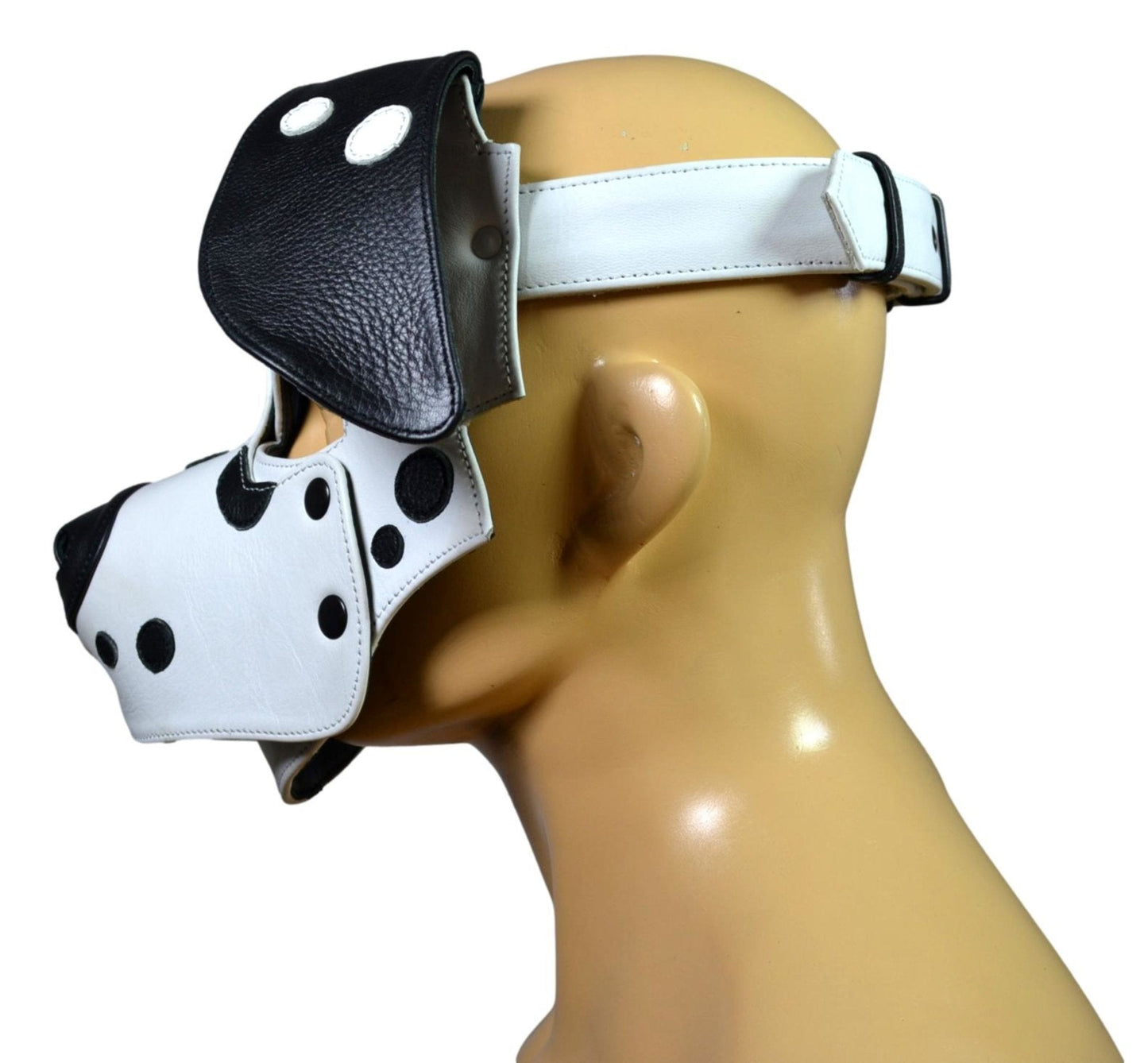 Dalmatian Leather Puppy Hood with black and white design, adjustable strap, and removable muzzle.