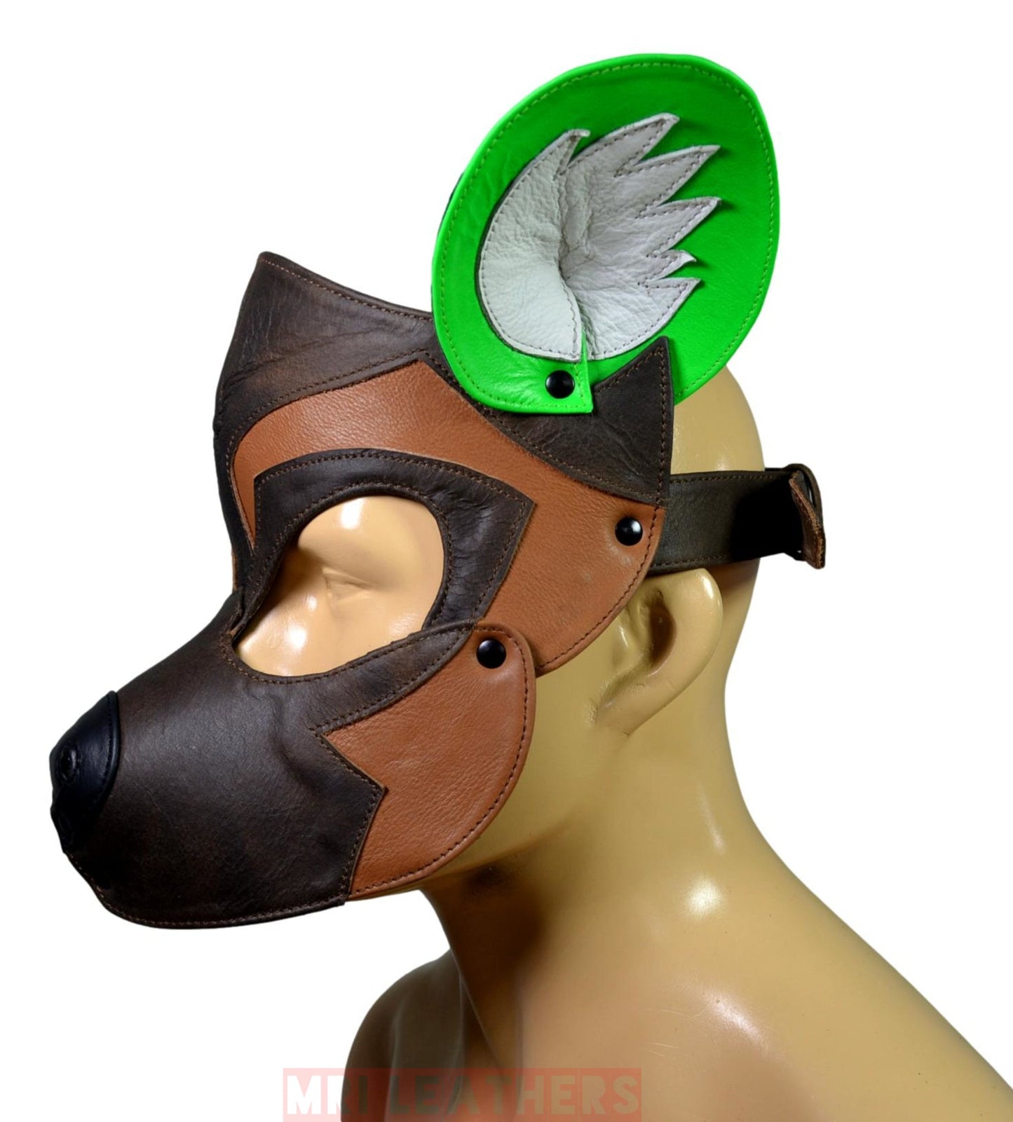 Brown and white leather dog mask with green ear insert, adjustable buckle, and stainless snaps.