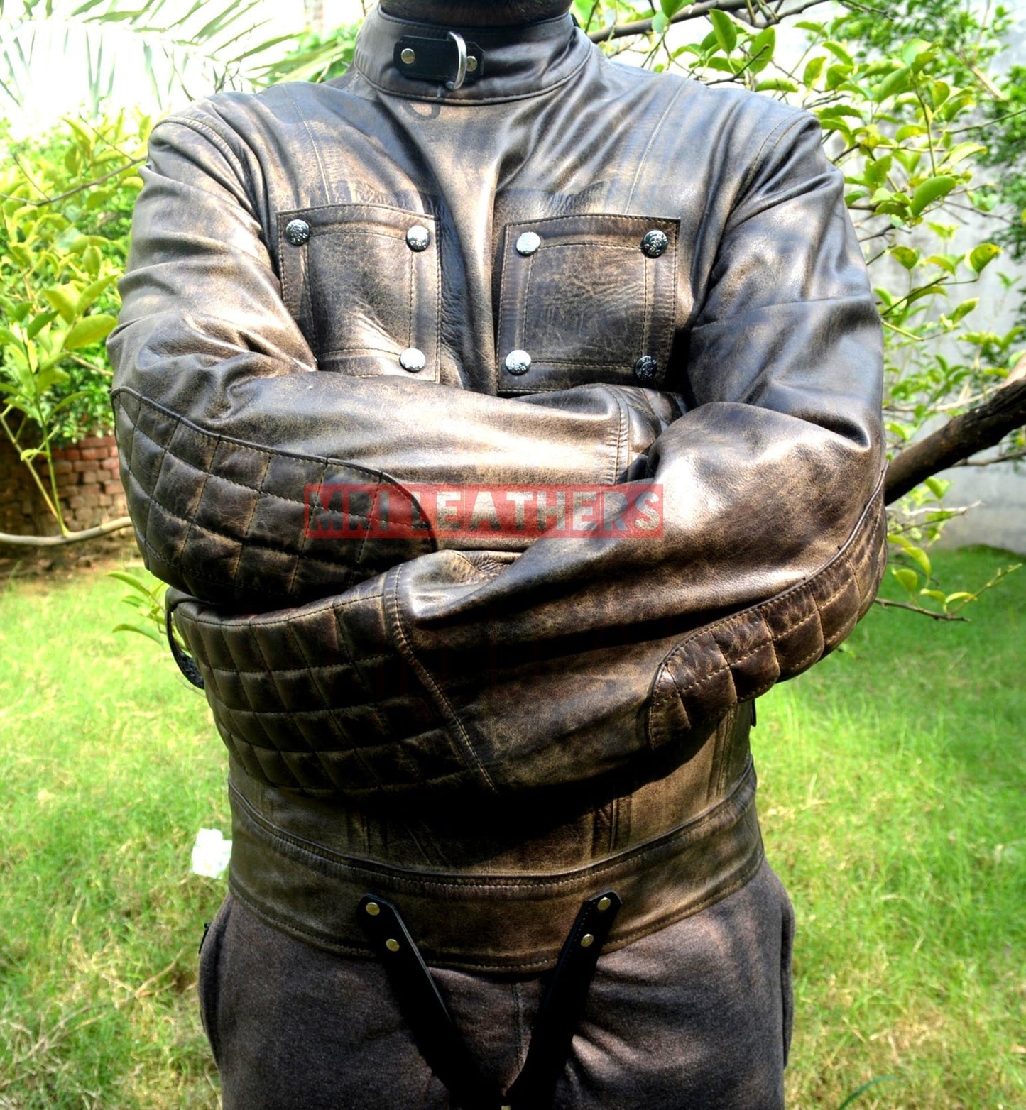 Pure leather BDSM strait jacket with padded sleeves and buckle closures for men and women.