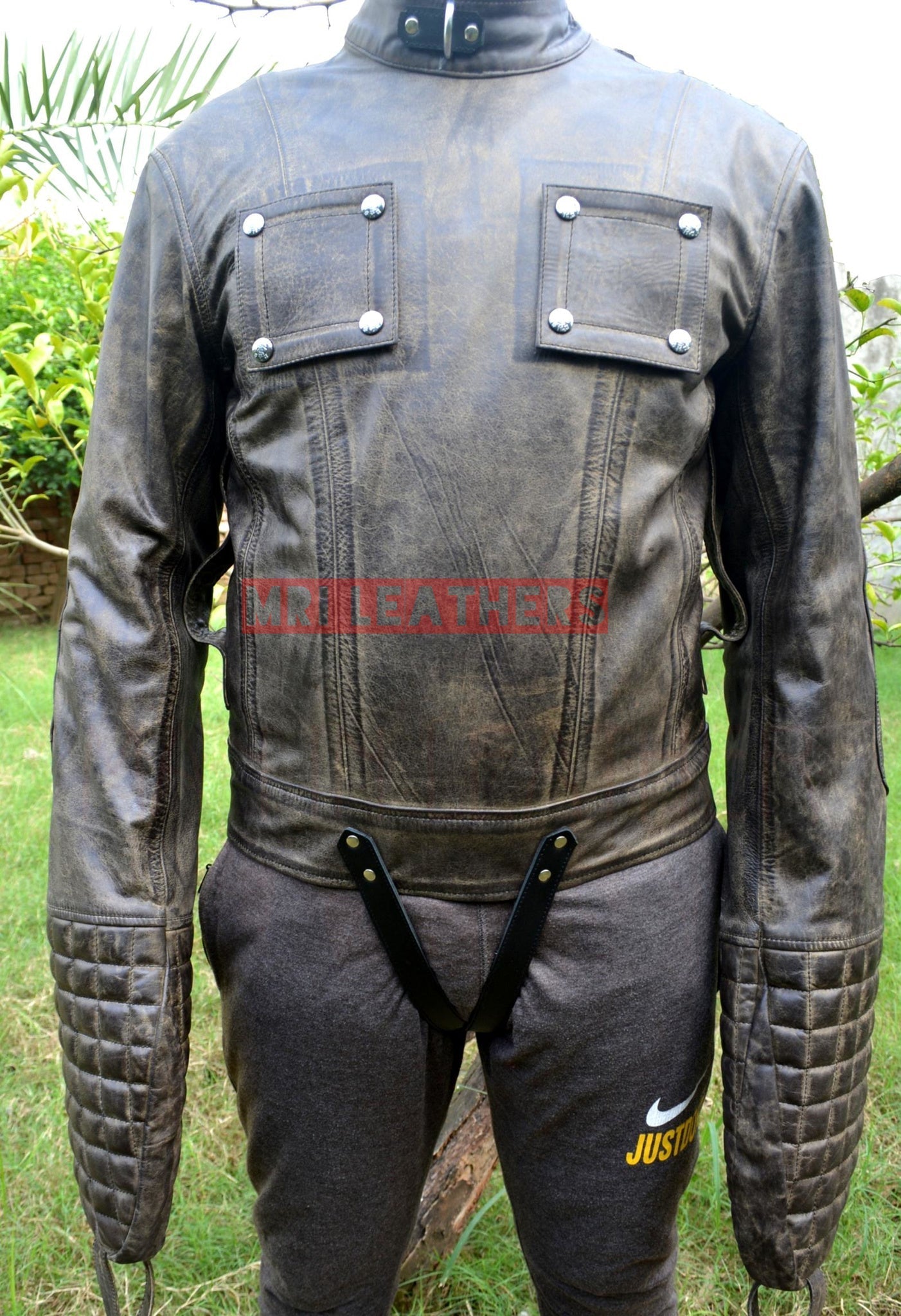 Strait jacket BDSM pure leather with buckle closures and long padded sleeves.
