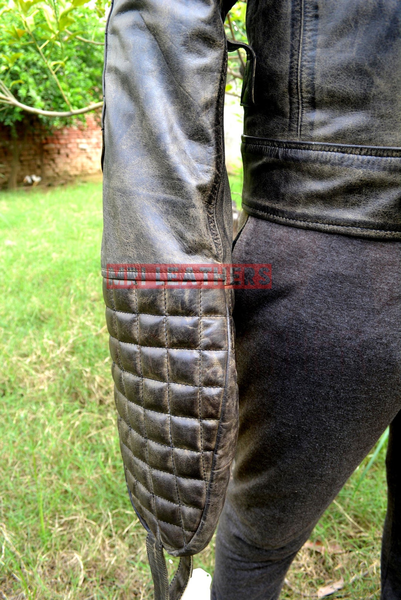 Pure leather BDSM strait jacket with padded sleeve and buckles.