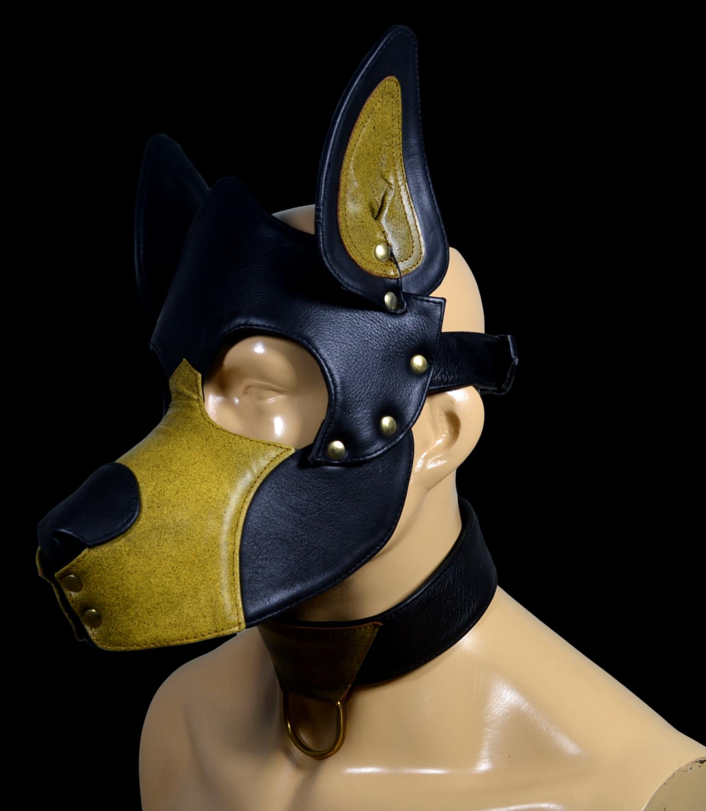 Leather pup hood with adjustable buckle and stainless snaps.